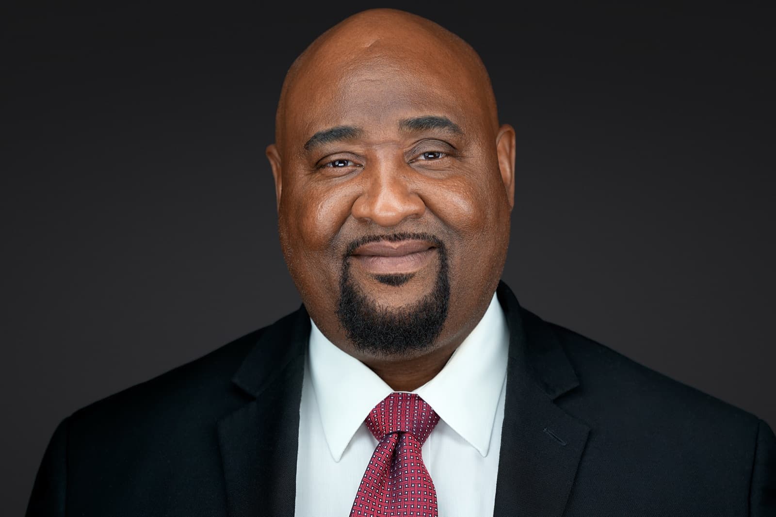Set of individual headshots from a completed team session, smiling professionals against a white background.
