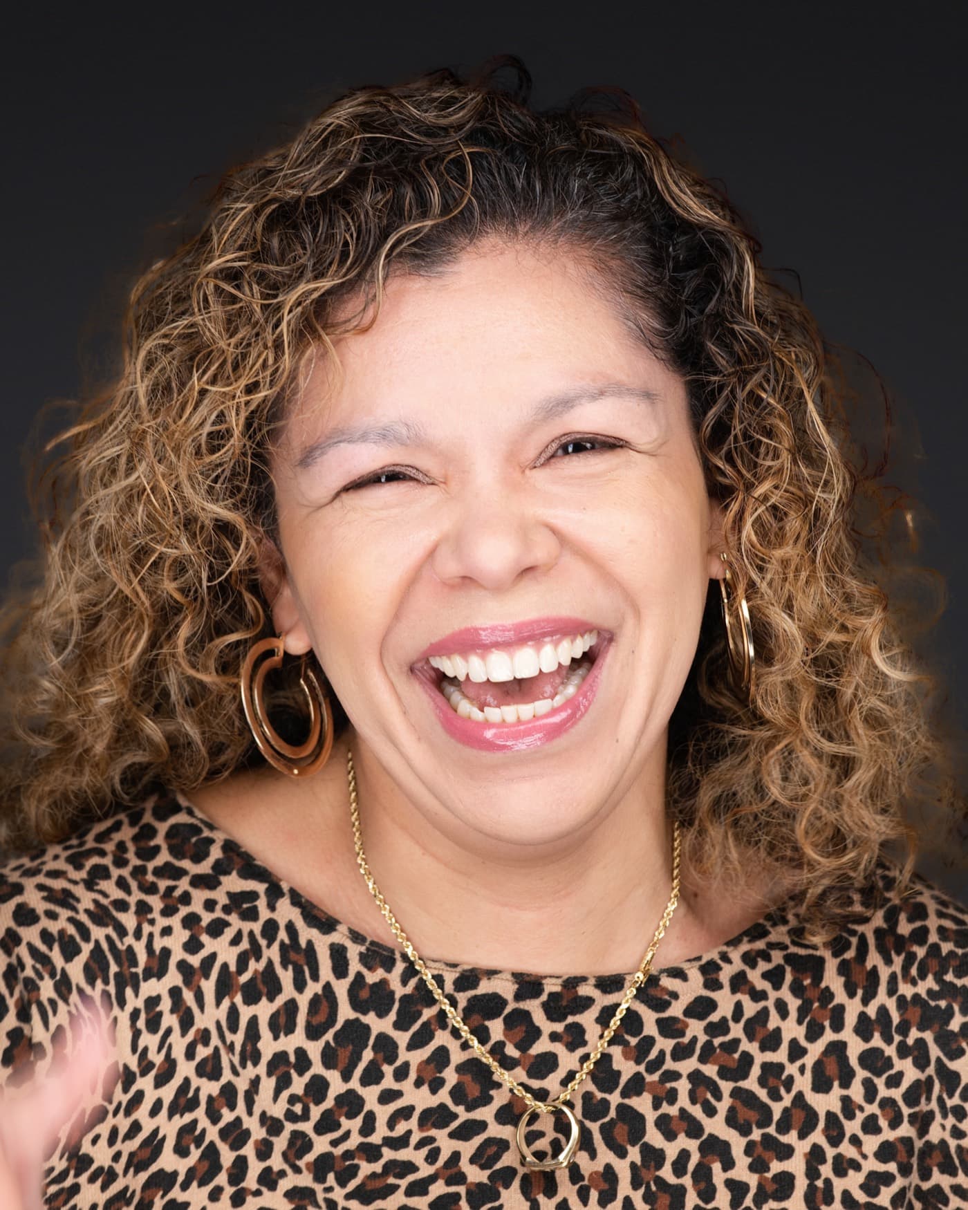 Set of individual booth headshots, each person smiling against a white background.