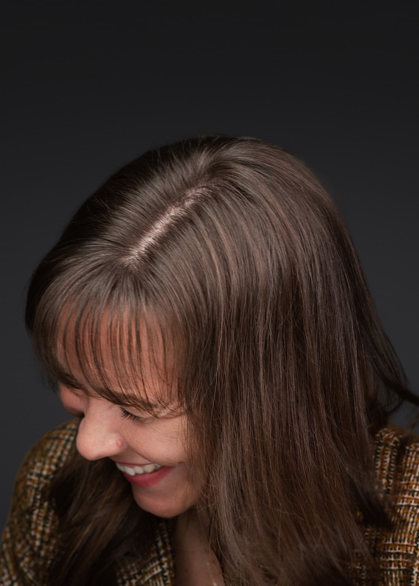 Set of individual booth headshots, each person smiling against a white background.