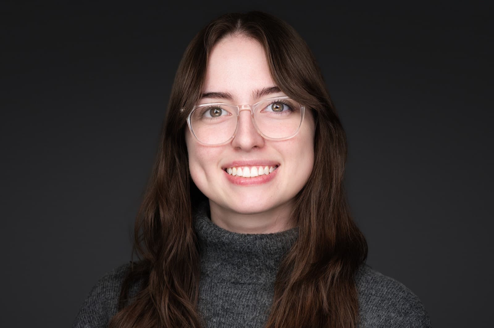 Set of individual booth headshots against a dark charcoal background.