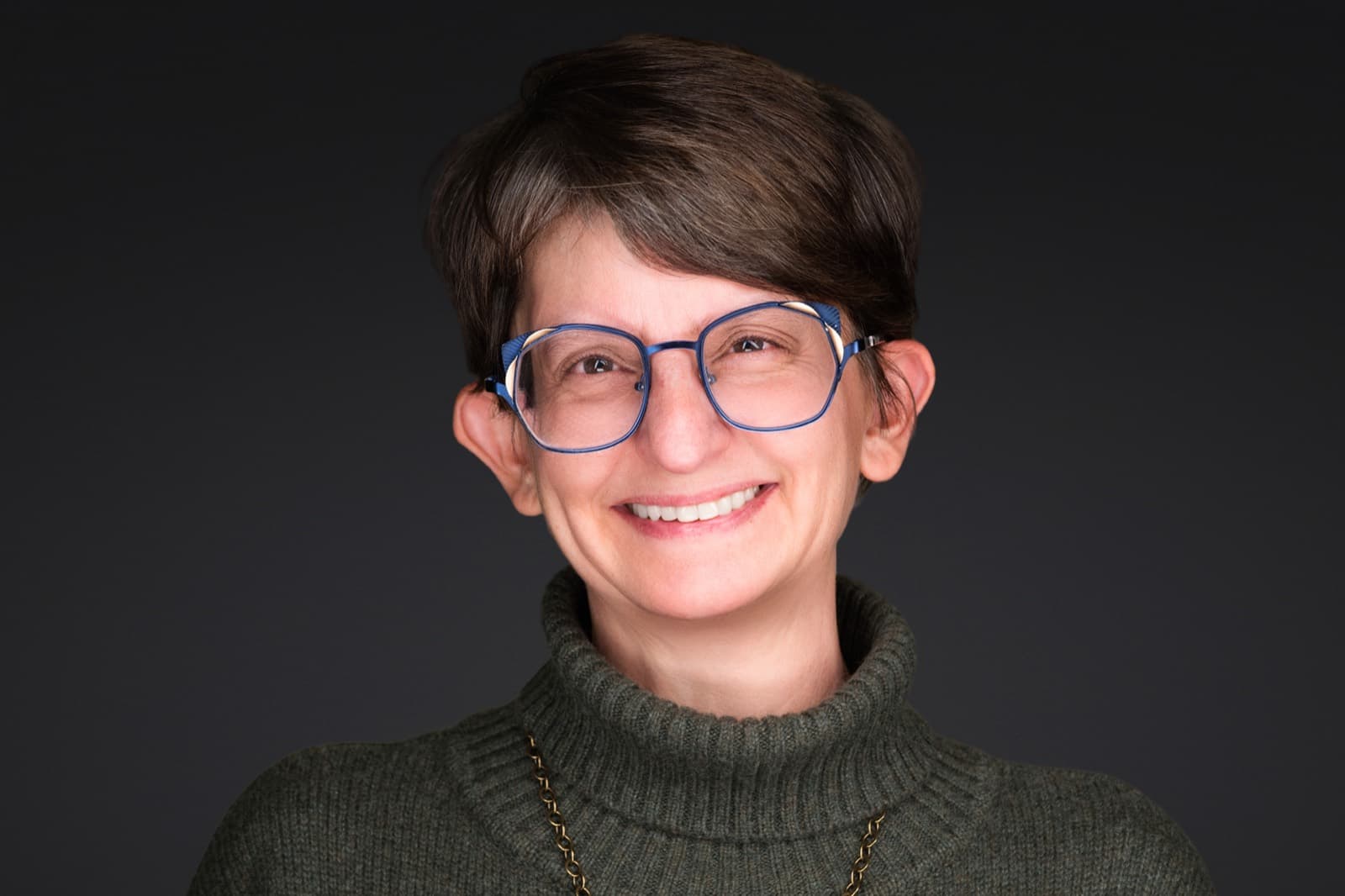 Set of individual booth headshots against a dark charcoal background.