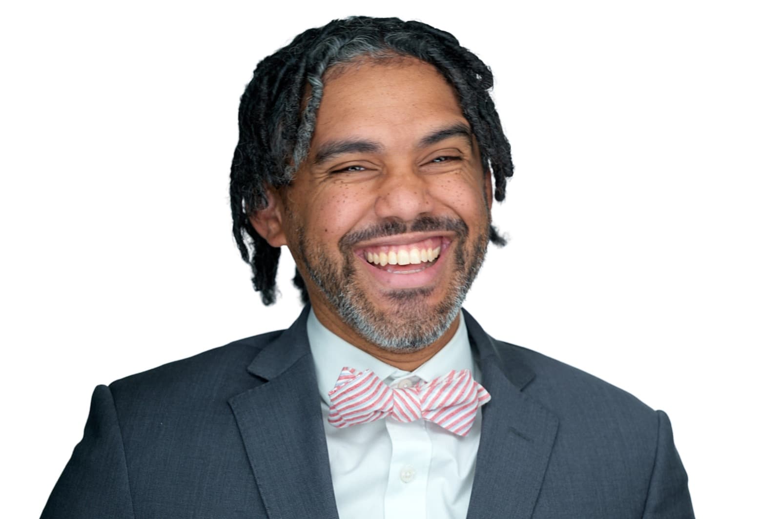 Set of individual corporate headshots, each person smiling against a plain white background.