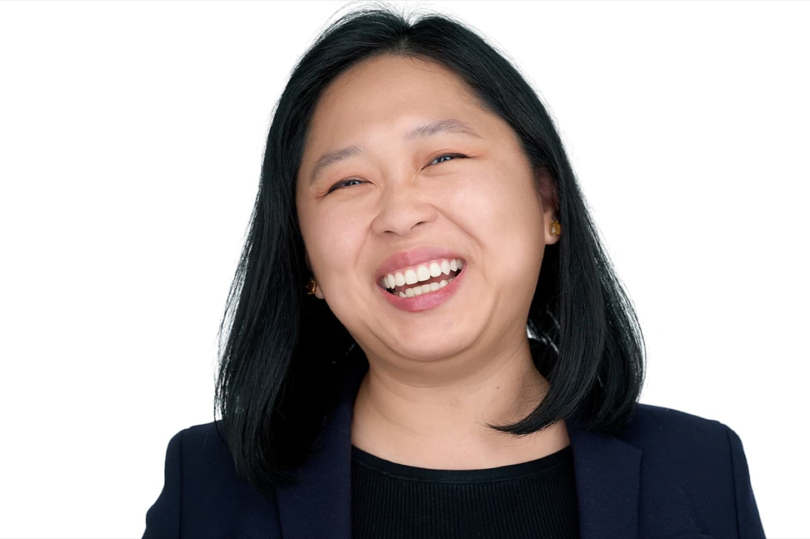 Set of individual corporate headshots, each person smiling against a plain white background.