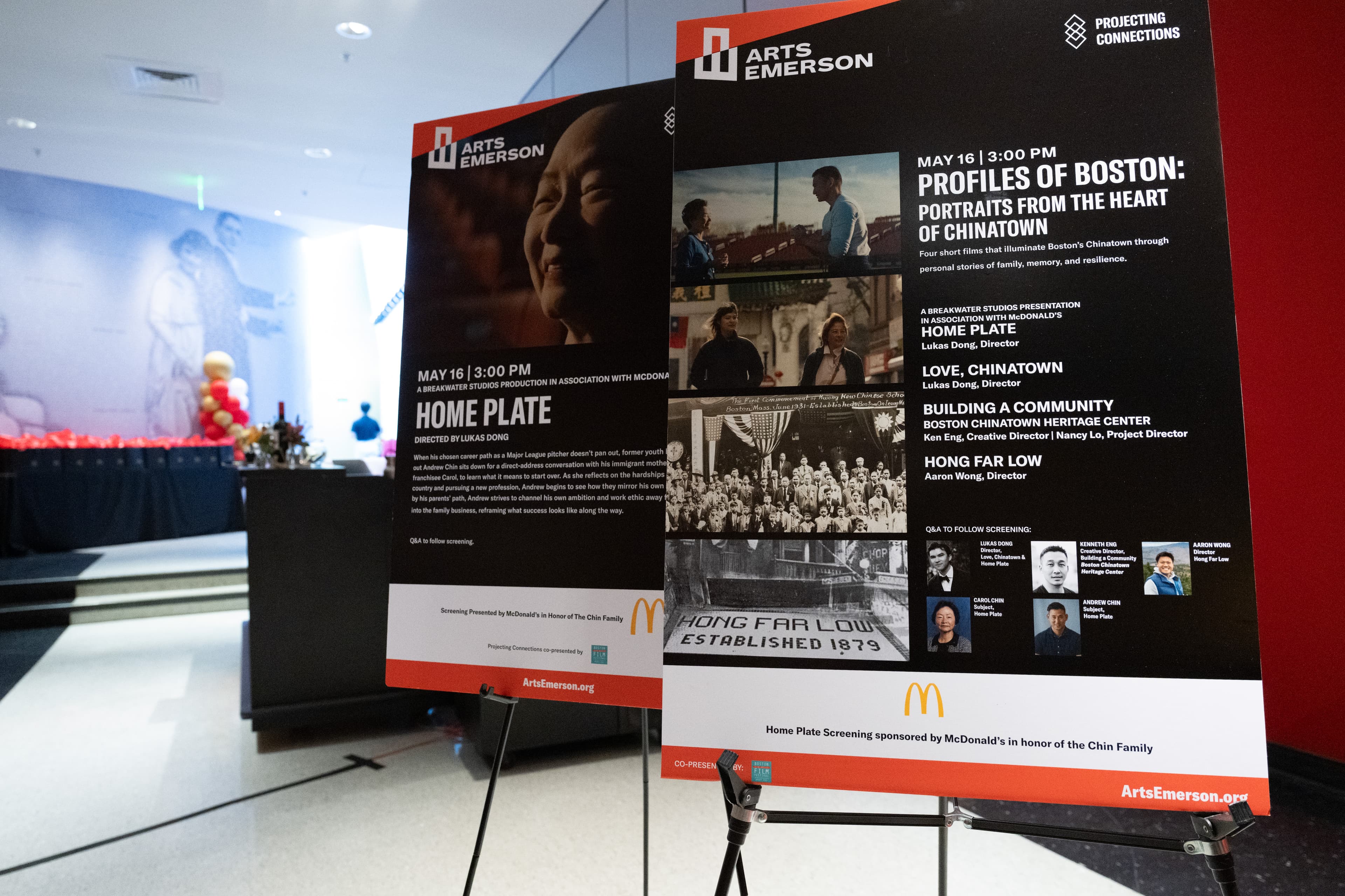 Two poster boards on stands advertising a short film program, one showing a close-up portrait, the other a poster.