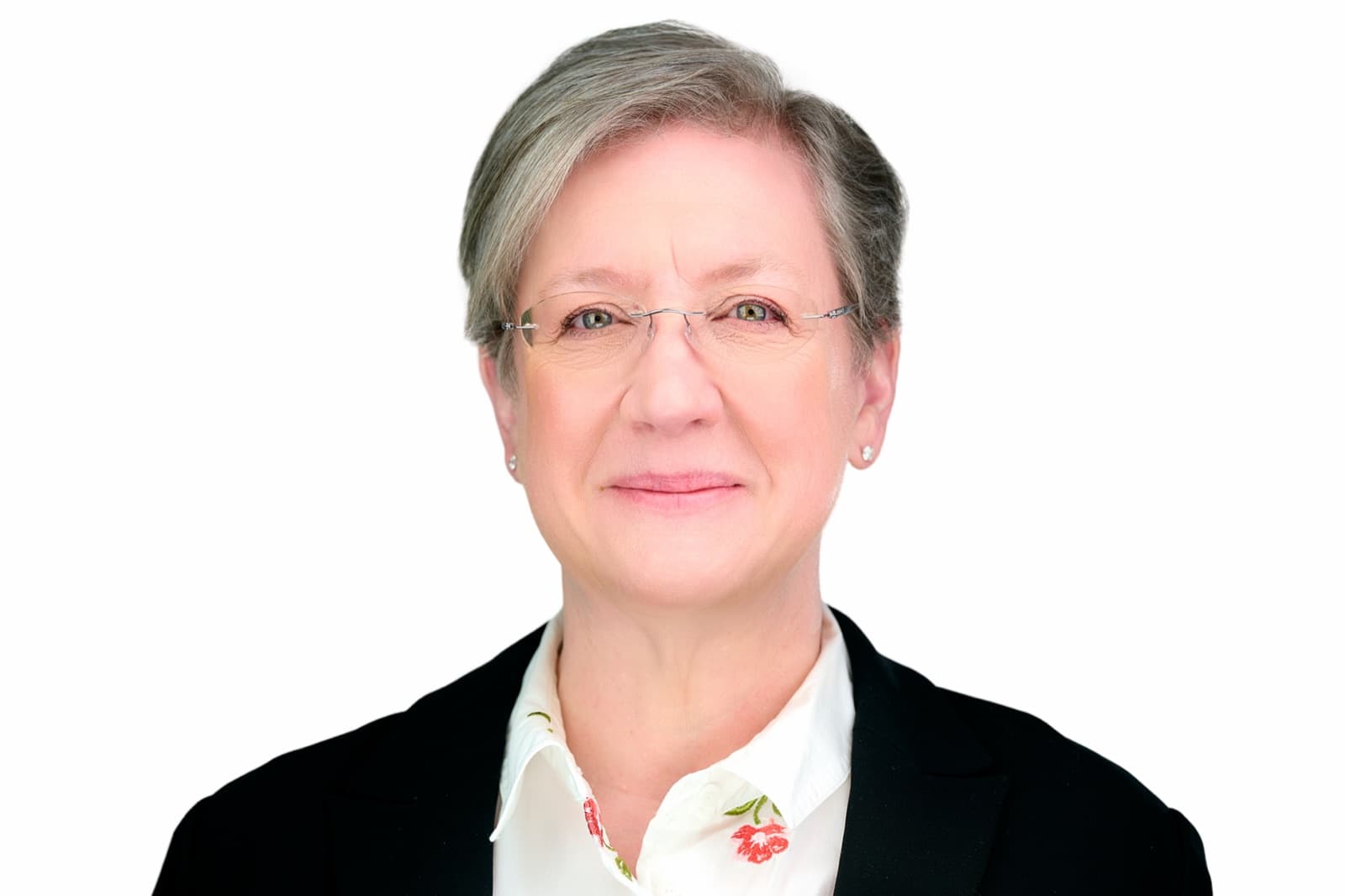 Set of individual headshots from a growing team, smiling professionals against a white background.