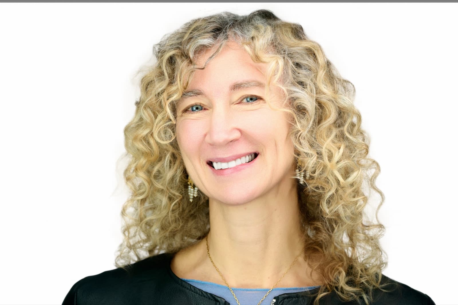 Set of individual headshots from a growing team, smiling professionals against a white background.