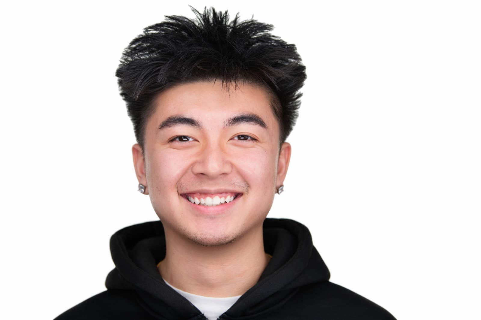 Set of individual booth headshots with playful expressions, including one person sticking out their tongue.