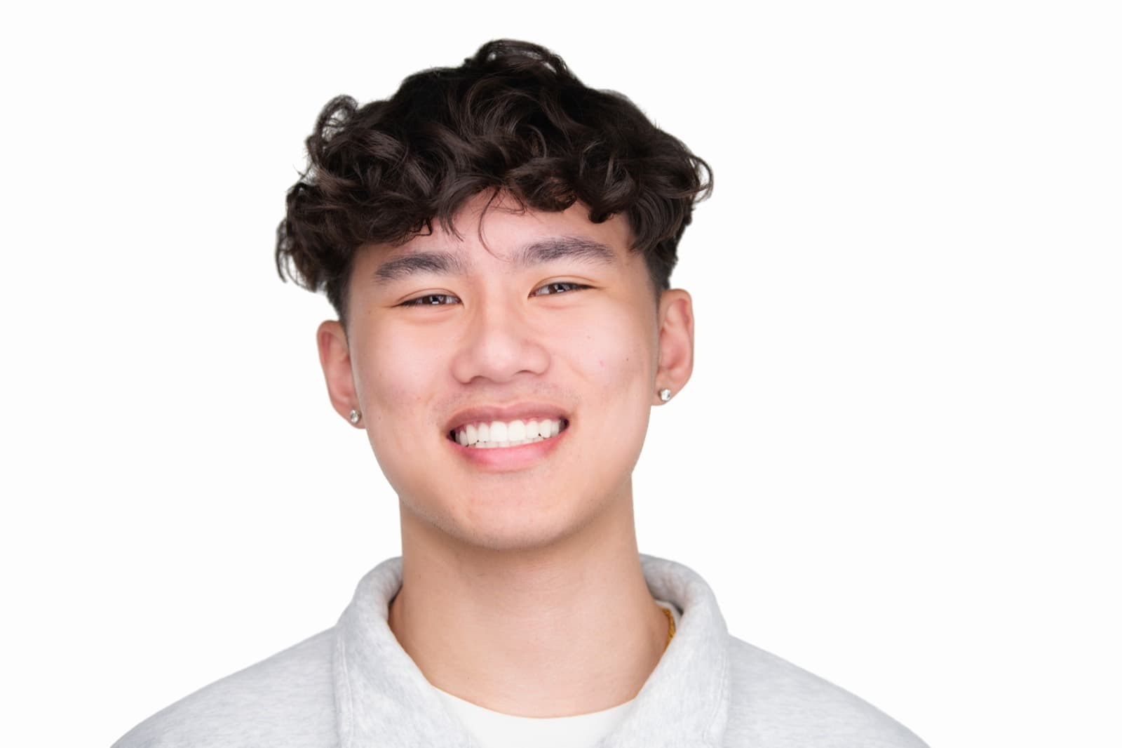 Set of individual booth headshots with playful expressions, including one person sticking out their tongue.