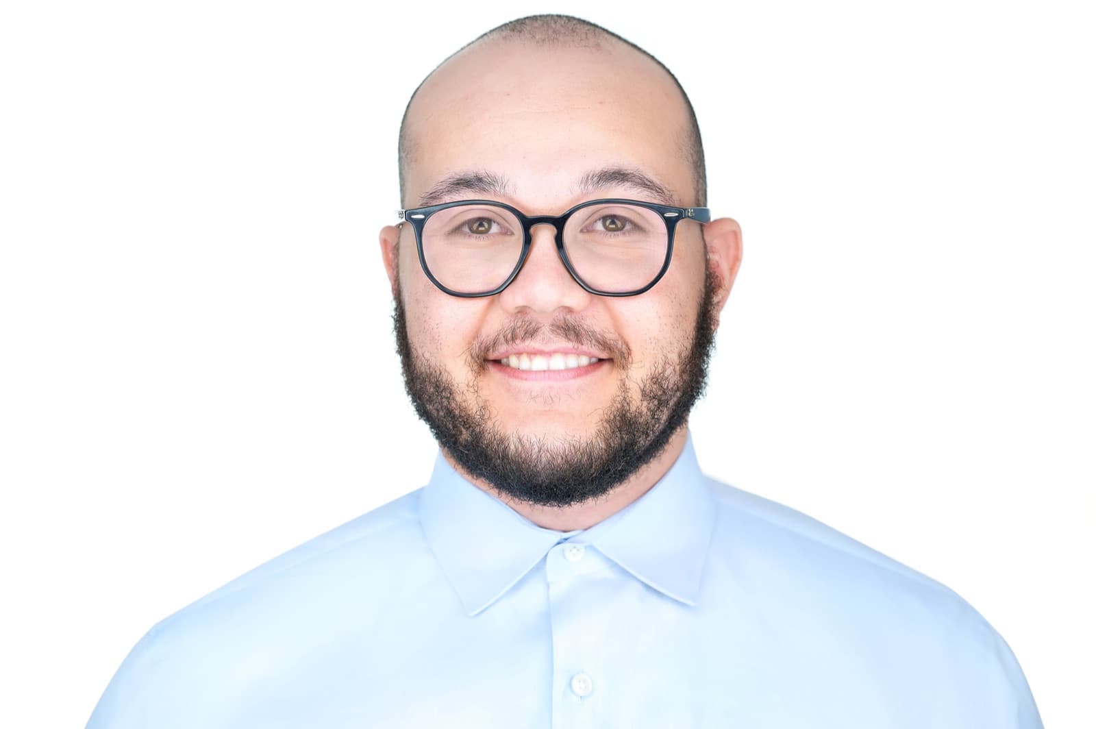 Set of individual headshots against white and gray studio backdrops, smiling professionals in business attire.
