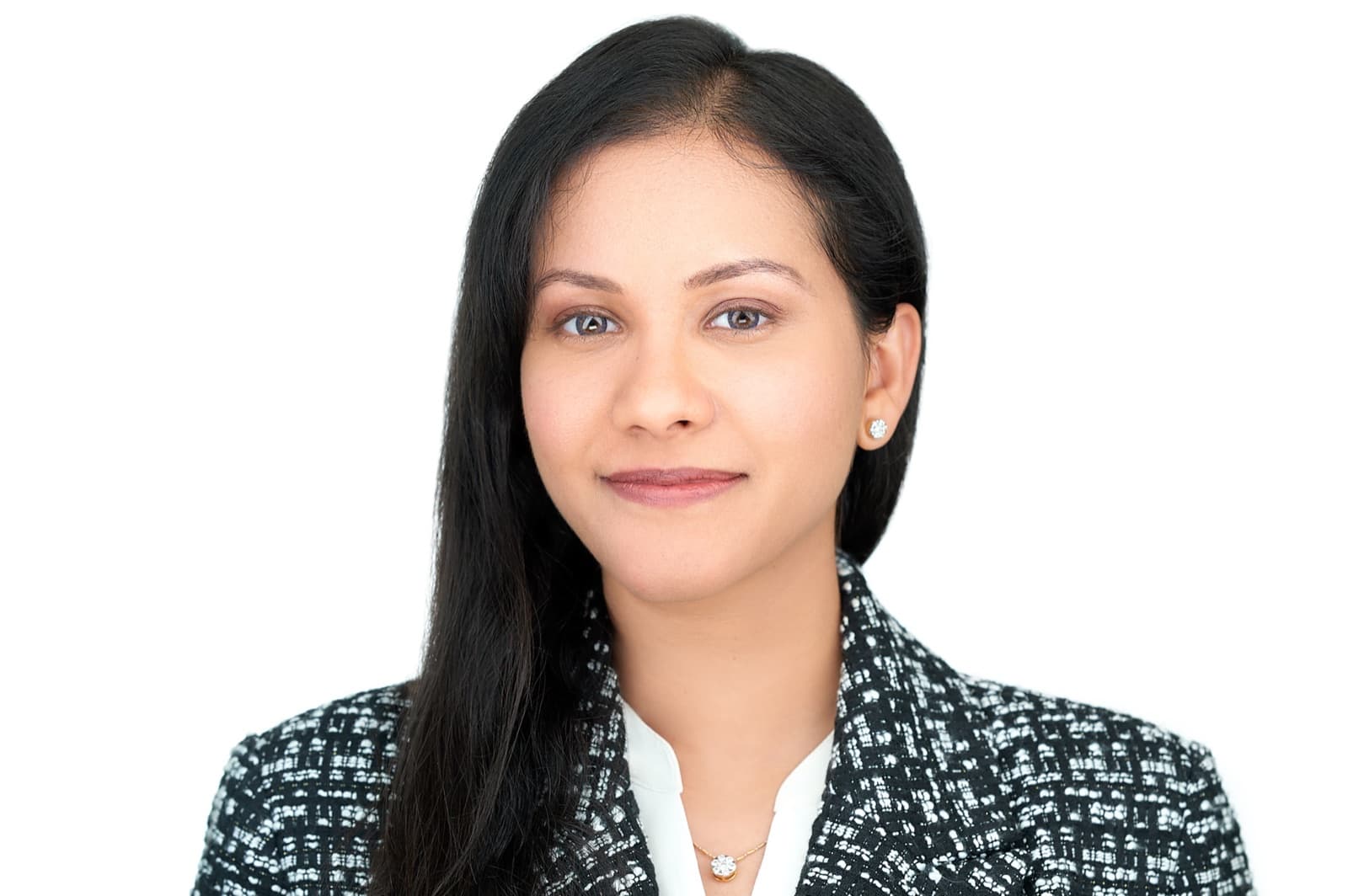 Set of individual headshots against white and gray studio backdrops, smiling professionals in business attire.