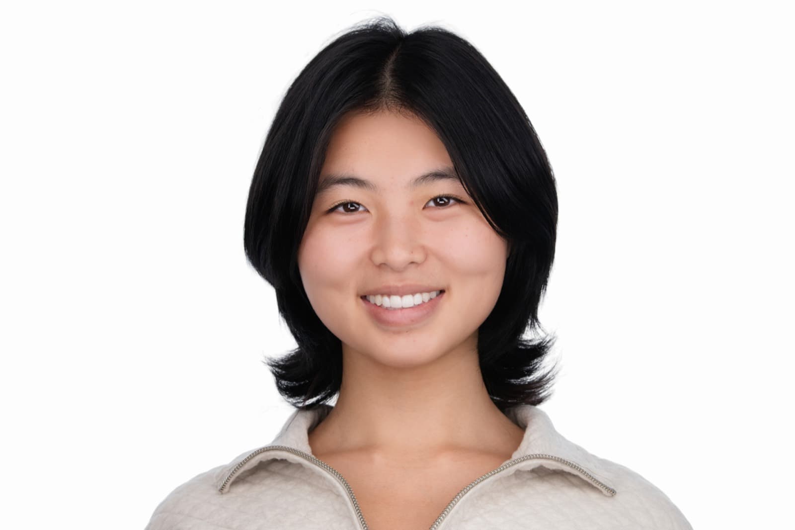 Set of individual booth headshots against a dark background, one wearing an event pin.
