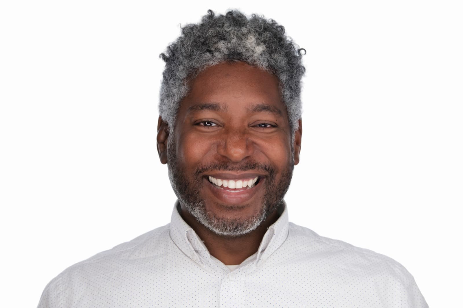 Set of individual booth headshots against a dark background, one wearing an event pin.