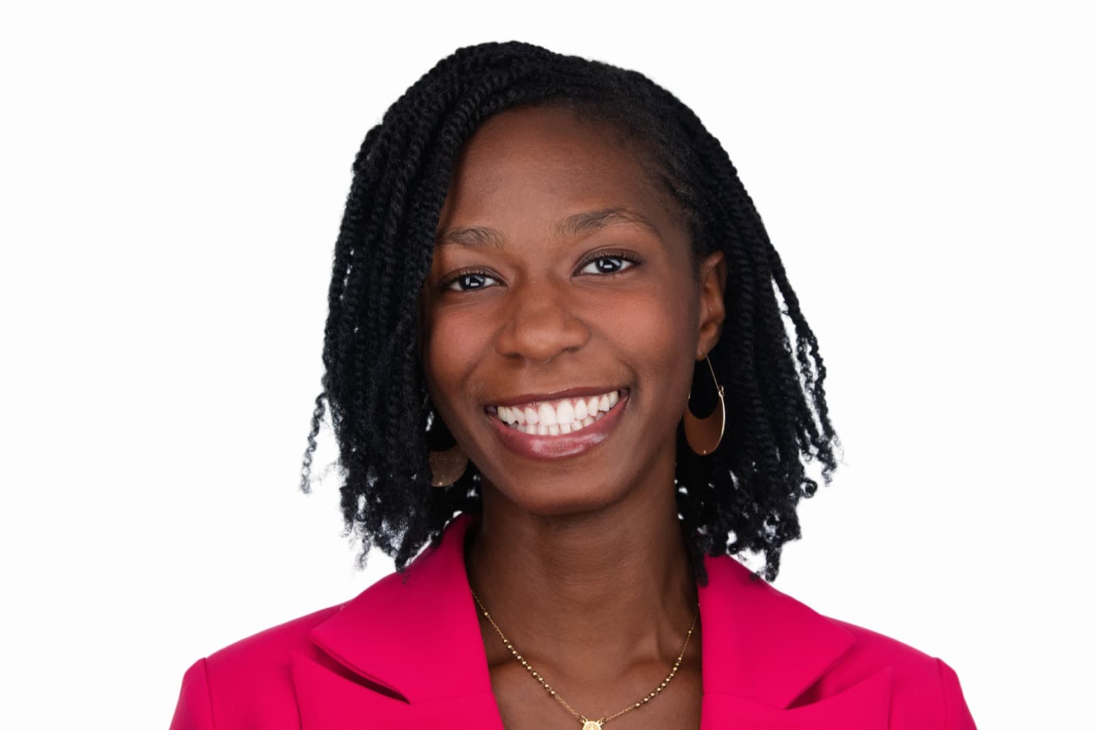 Set of individual booth headshots against a dark background, one wearing an event pin.