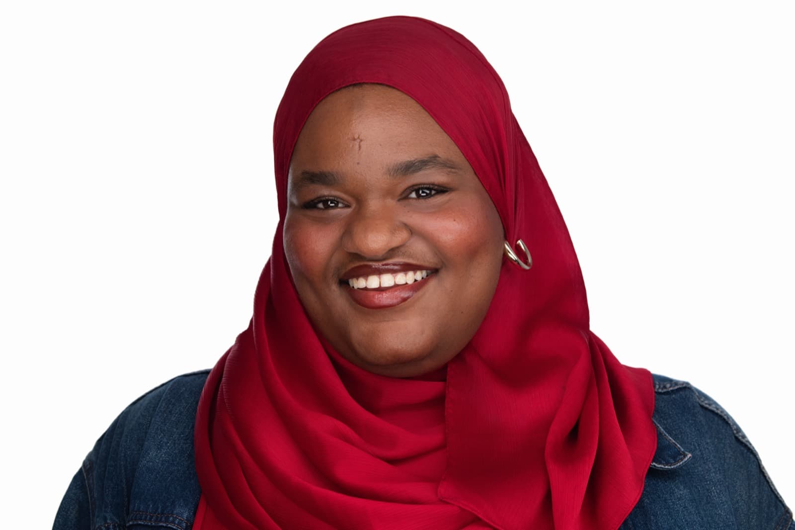 Set of individual booth headshots against a dark background, one wearing an event pin.