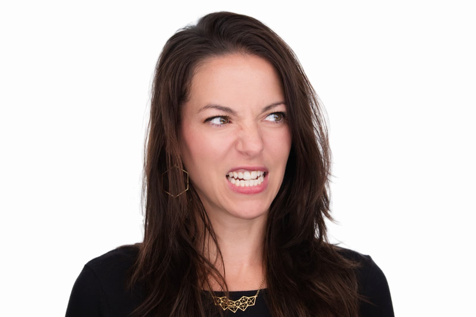 Set of individual booth headshots against a dark background, one wearing an event pin.